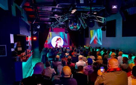 Club Café Moonshine Room stage performance with theatre style seating arrangement